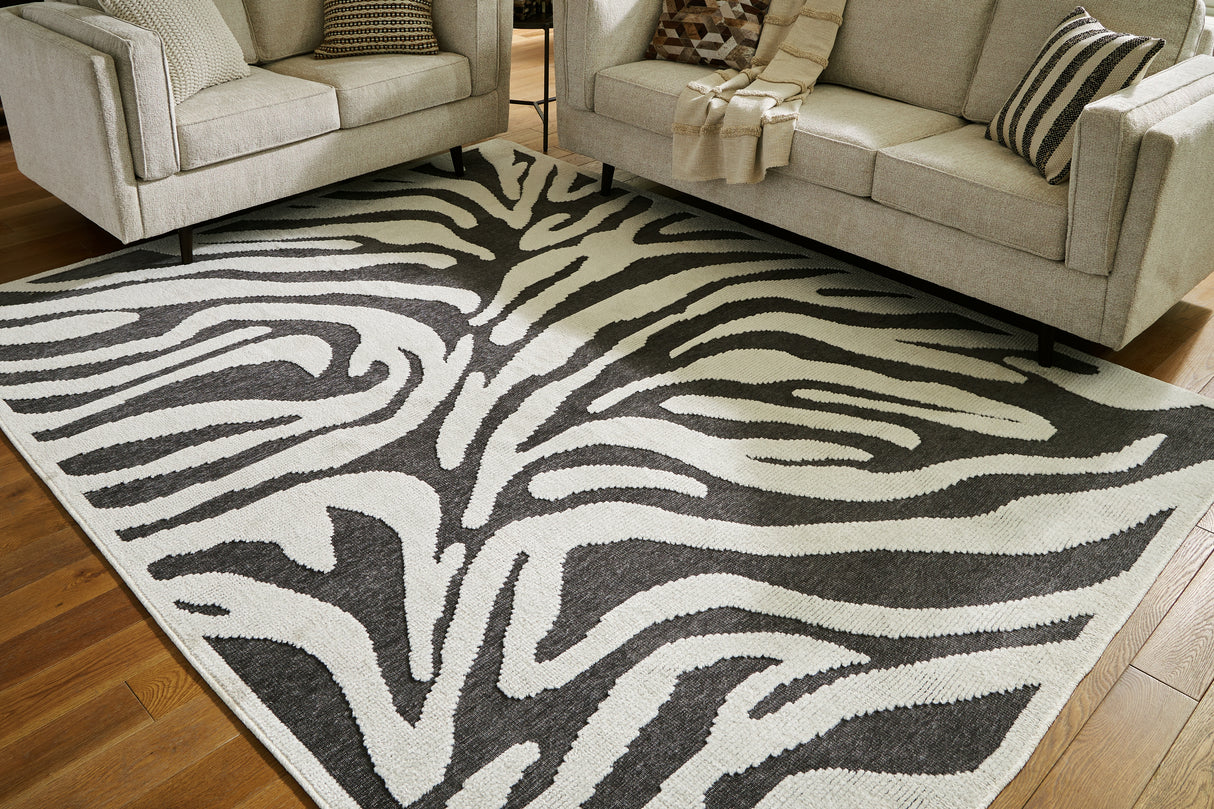 Mega Furniture - Ashley Furniture - Thomwith Rug - 8' x 10'2" Washable Rug / Black/Ivory - R406291