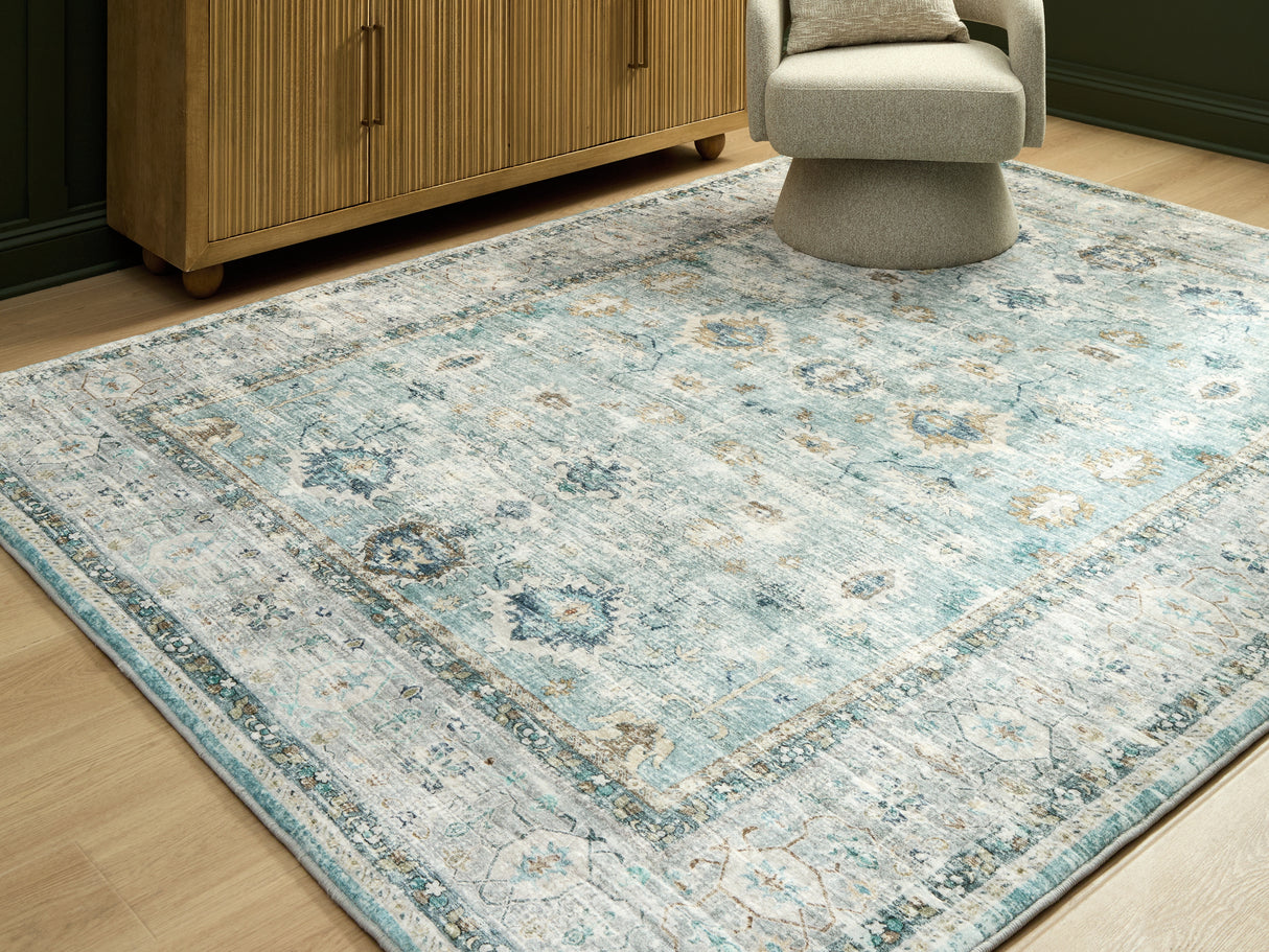 Mega Furniture - Ashley Furniture - Ladstoney Rug - 5' x 7' Area Rug / Teal/Beige/Ochre - R407502