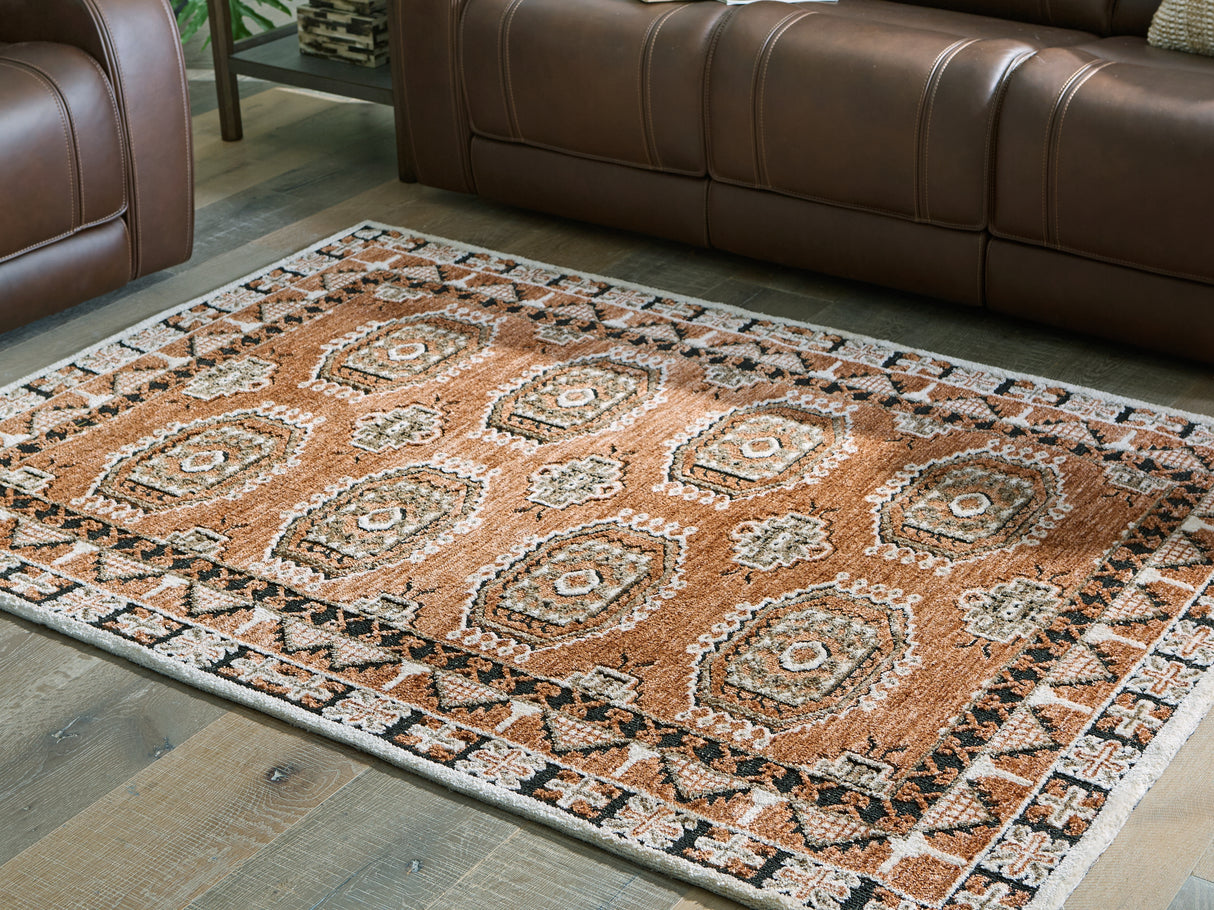 Mega Furniture - Ashley Furniture - Qaabiz Rug - 5' x 7' Area Rug / Sienna/Ivory/Black - R407522