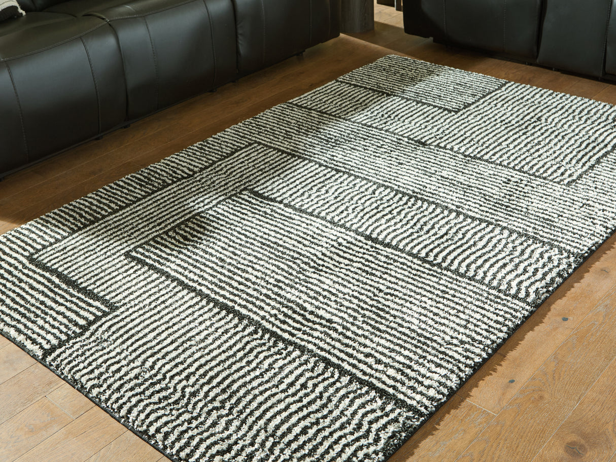 Mega Furniture - Ashley Furniture - Kurtmen Rug - 5' x 7' Area Rug / Black/Ivory - R407592