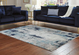 Mega Furniture - Ashley Furniture - Leonelle Rug - 7'10" x 10' Rug / White/Blue/Gray - R404871