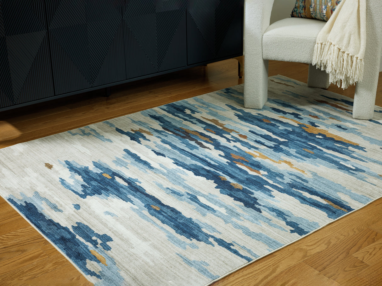 Mega Furniture - Ashley Furniture - Vinlett Rug - 5' x 7' Washable Rug / Cream/Blue/Brown - R407042