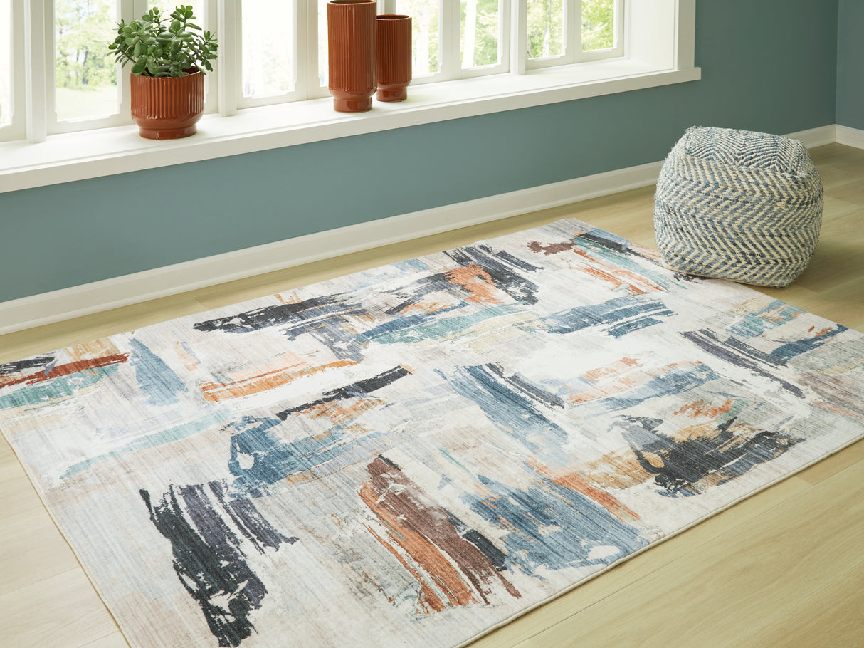 Mega Furniture - Ashley Furniture - Hessland Rug - 5' x 7' Washable Rug / Multi - R407052