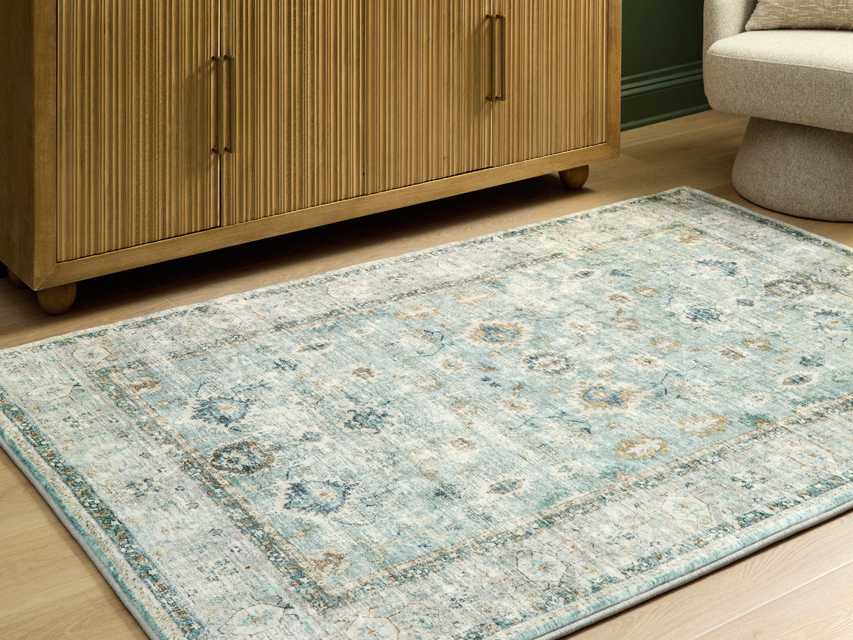 Mega Furniture - Ashley Furniture - Ladstoney Rug - 5' x 7' Area Rug / Teal/Beige/Ochre - R407502